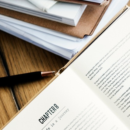 reading book with coffee mug